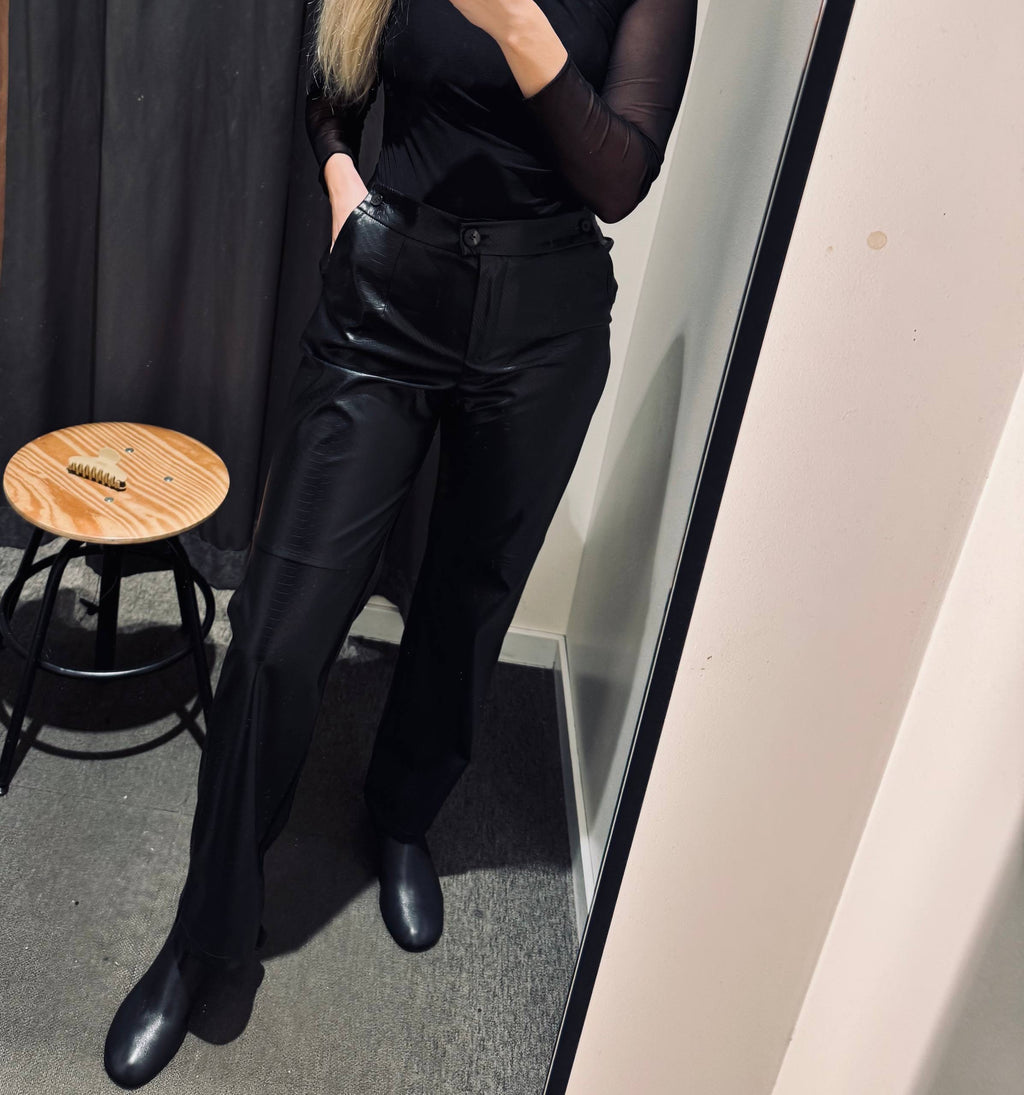 Eko odinės kelnės su reguliuojamu juosmeniu .